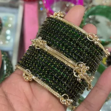 Elegant Black Beaded Gold Charm Bangle Set